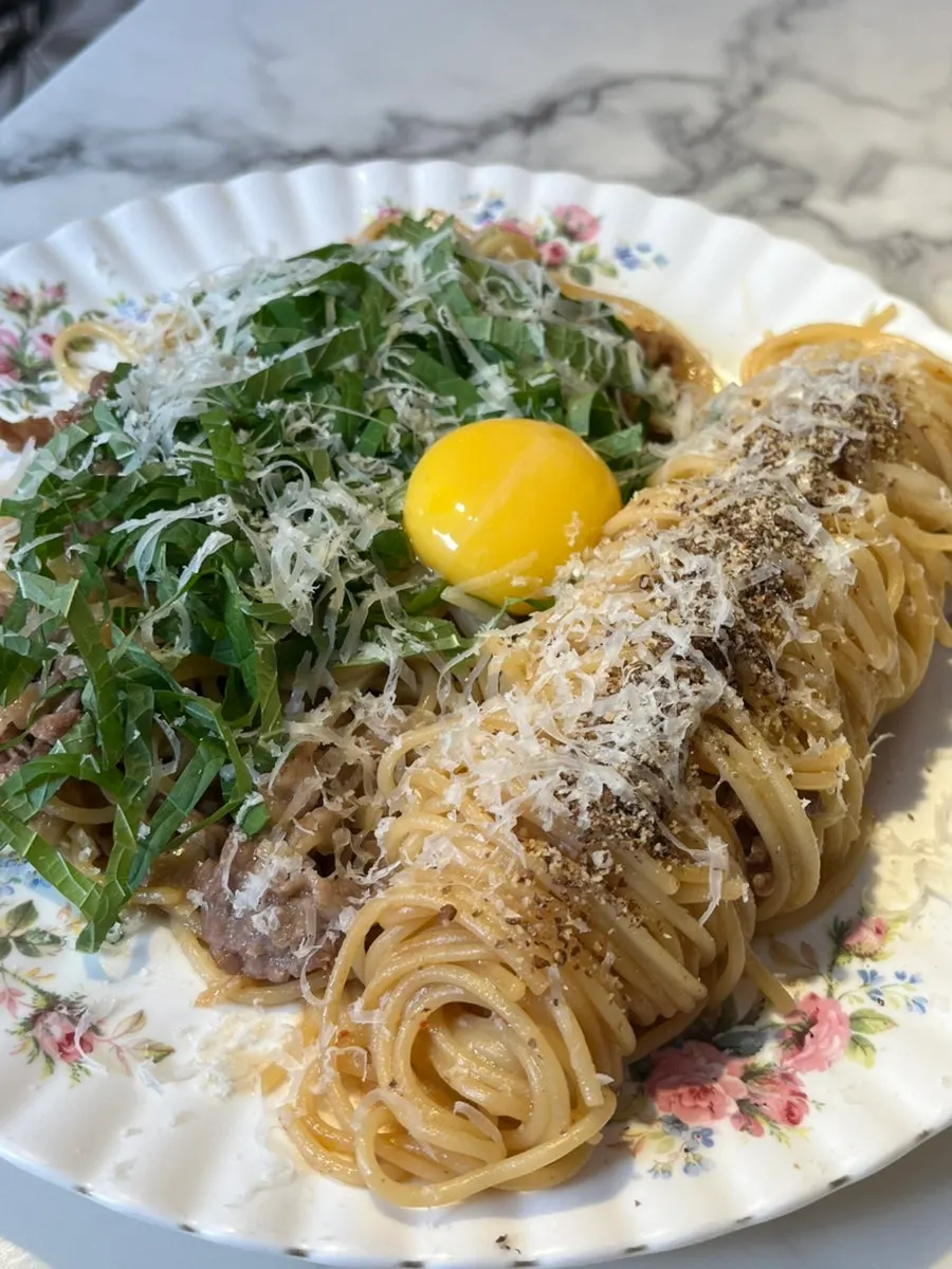 Pasta topped with beef brisket and perilla seed powder