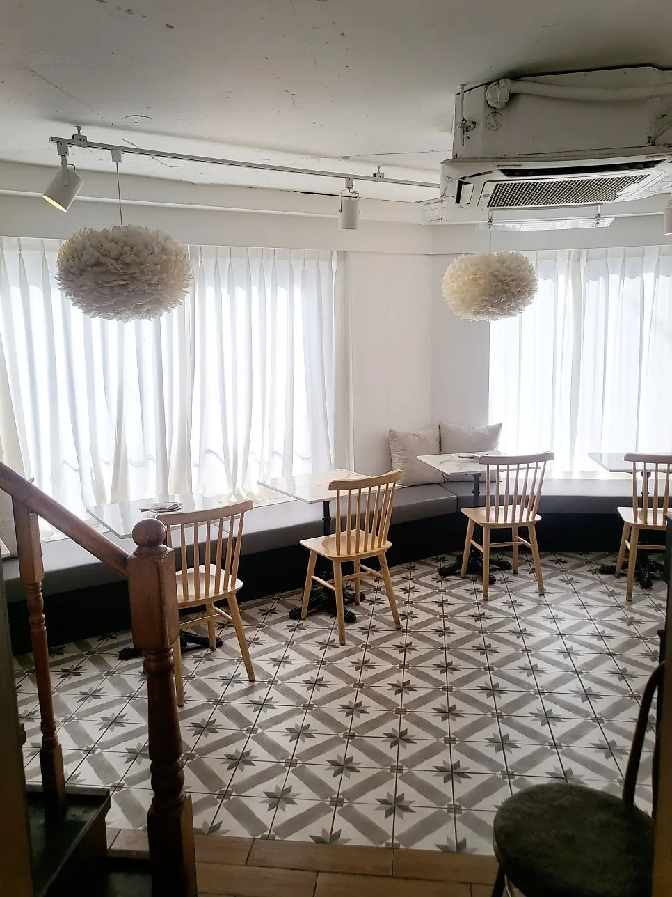 White-toned interior with wood furniture at Seongsu Darak