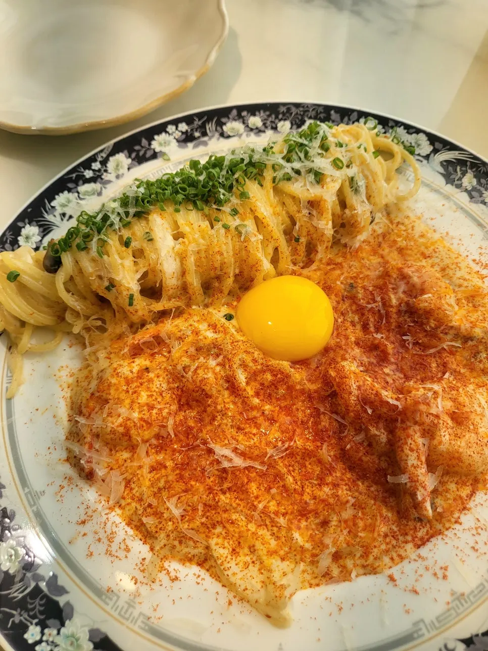 Egg yolk on top of the Spicy Cream Pasta