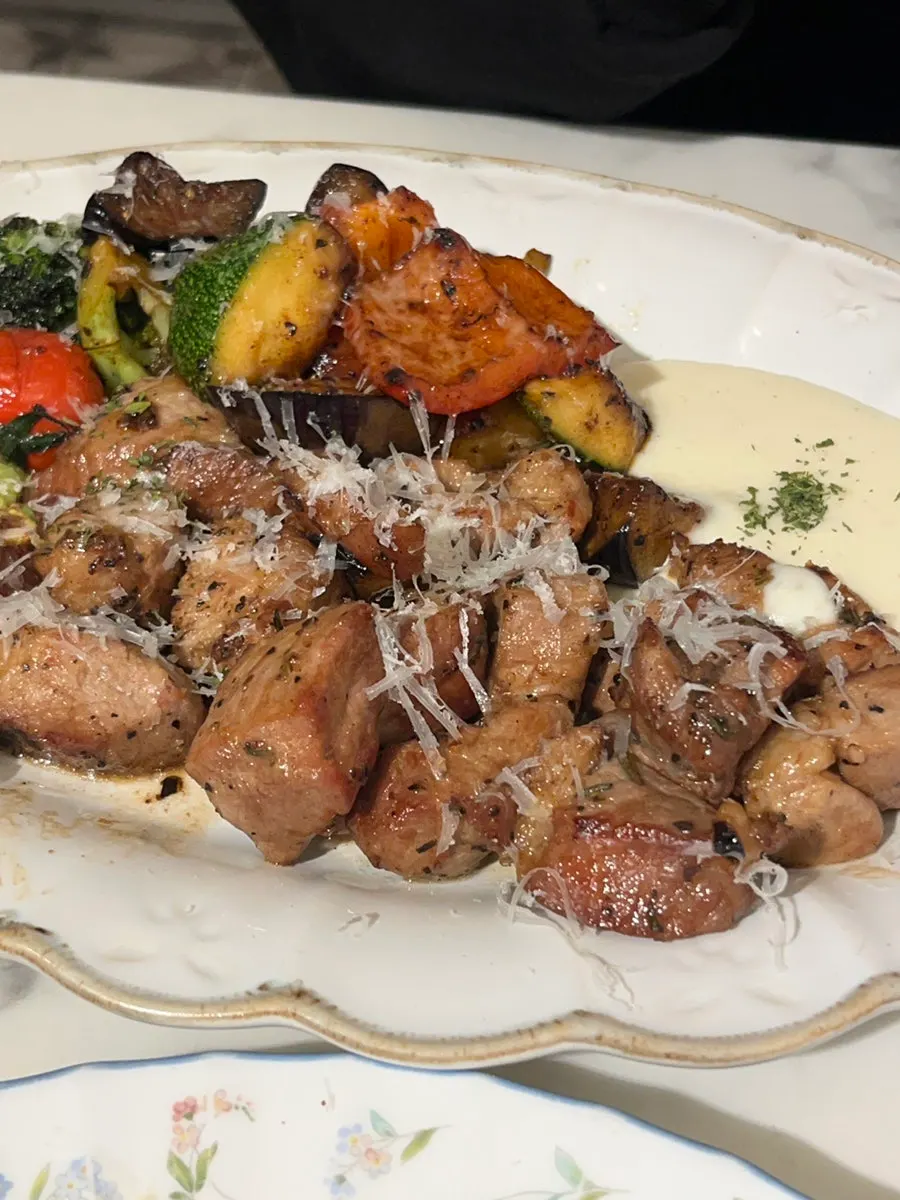 Grilled pork shoulder steak cut into easy bite-sized pieces