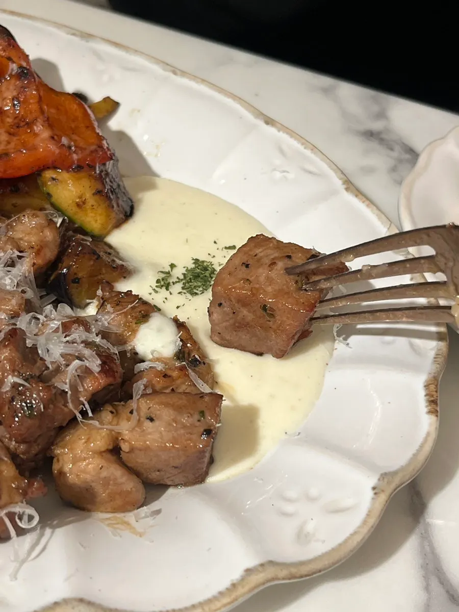 Pork shoulder steak topped with steak sauce