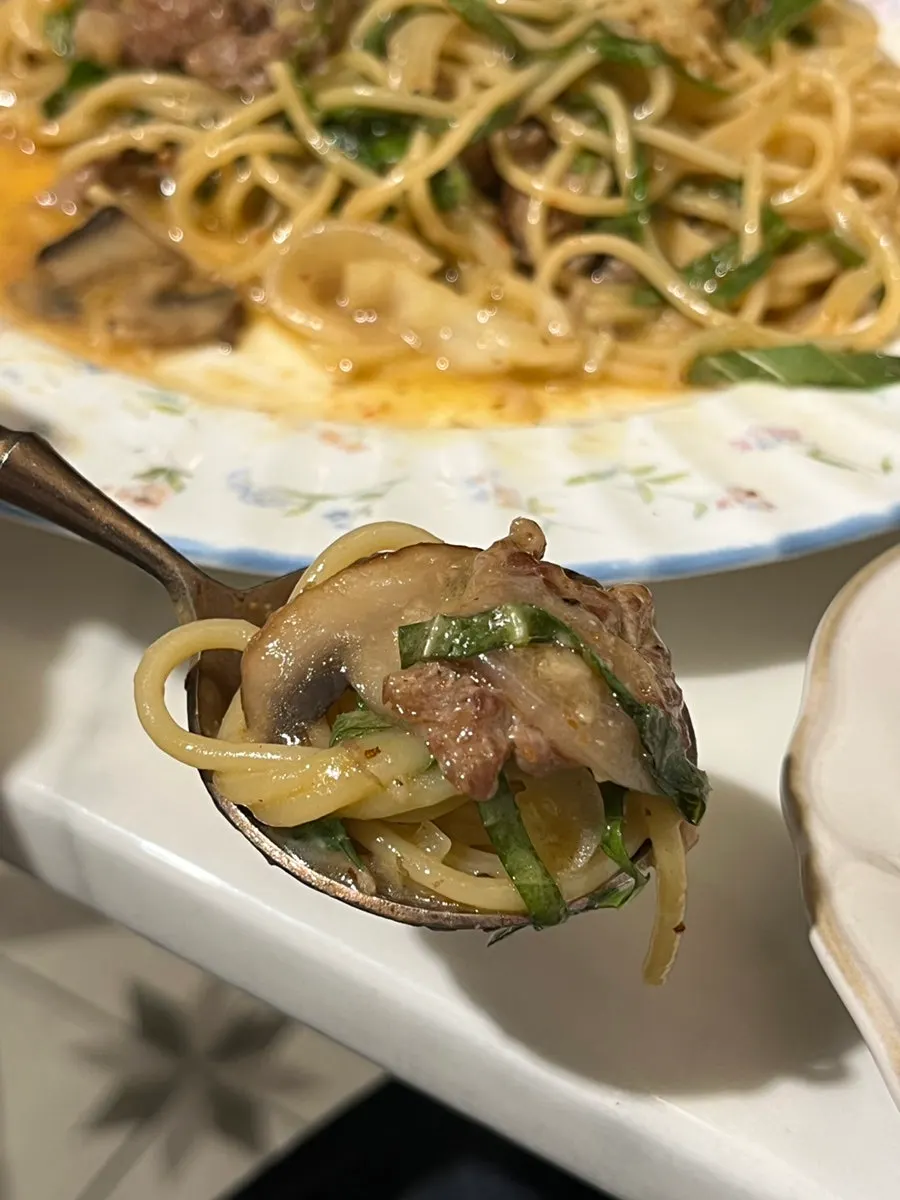 Twirling up noodles from the brisket perilla pasta