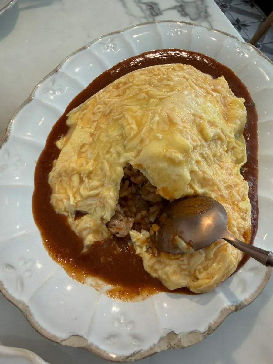 A spoonful scooped from the Darak omurice