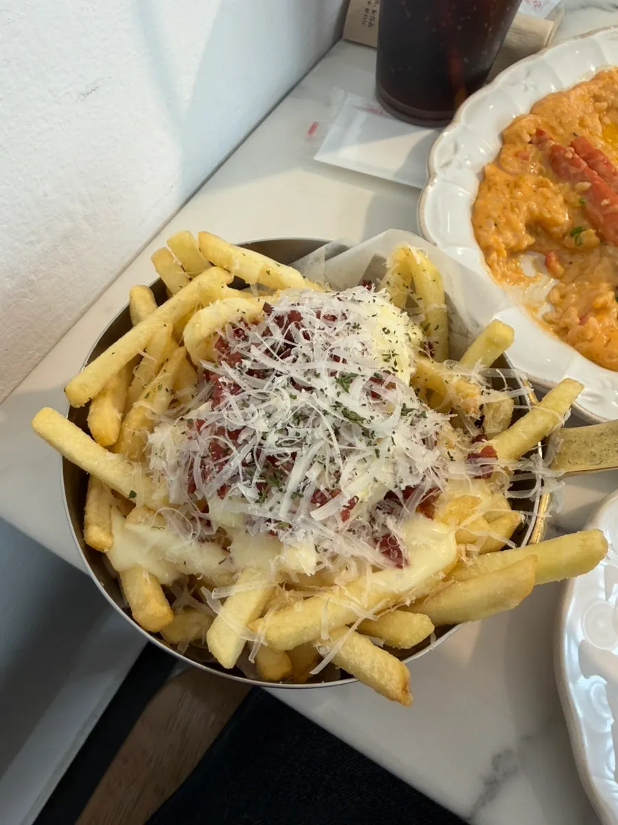 Picking up a single fry from the plate