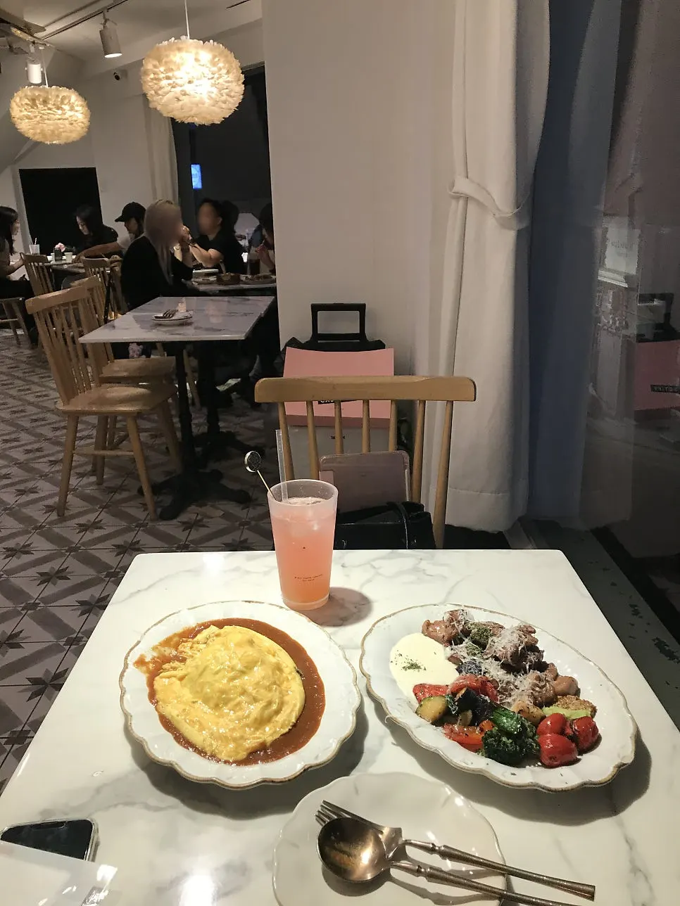 Table set with the ordered omurice and steak at Seongsu Darak