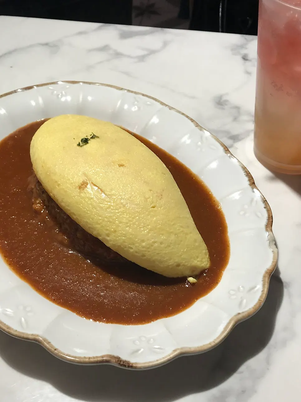Darak omurice with an egg blanket that looks like it's about to spill over