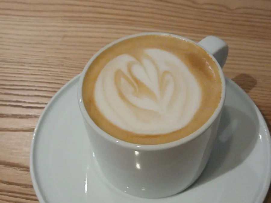 Hot café latte switched to decaf and oat milk
