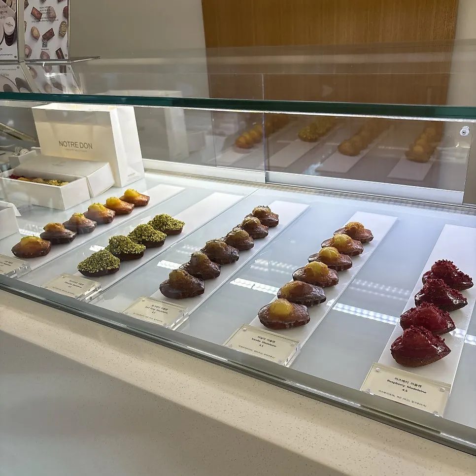 A display case of various madeleines