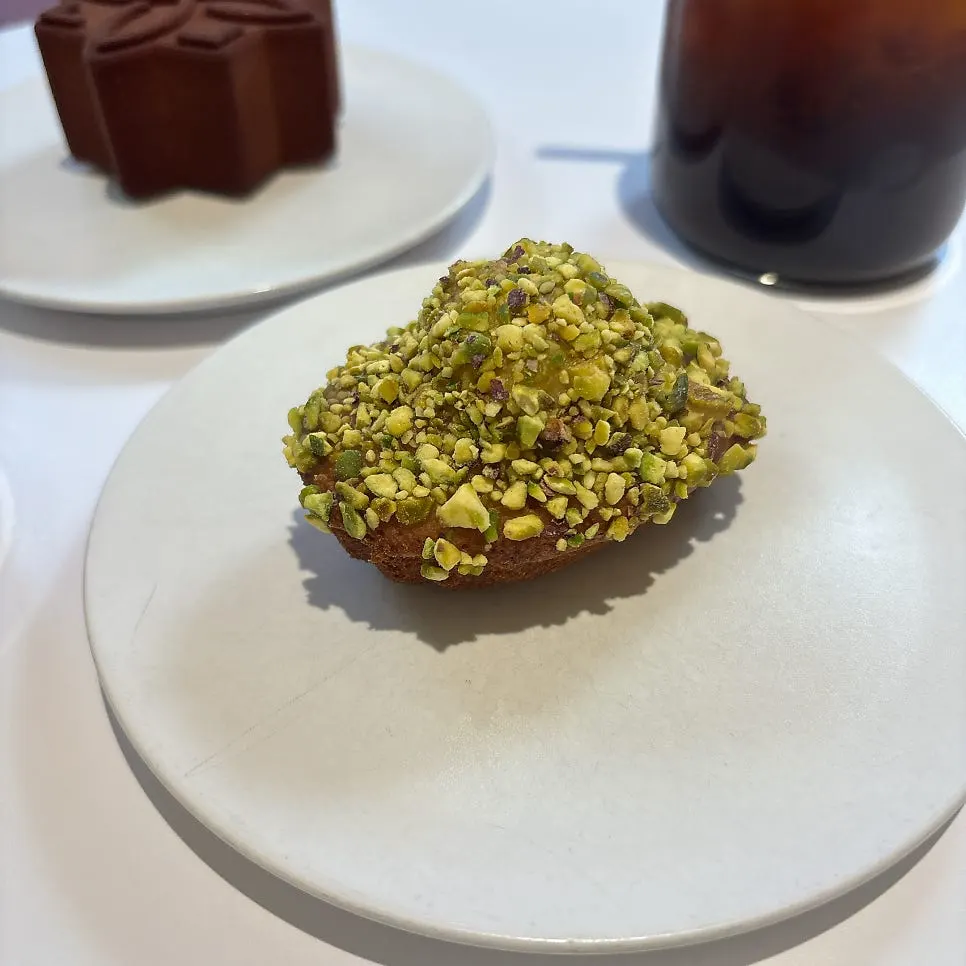 Dessert and coffee on a table set with napkins
