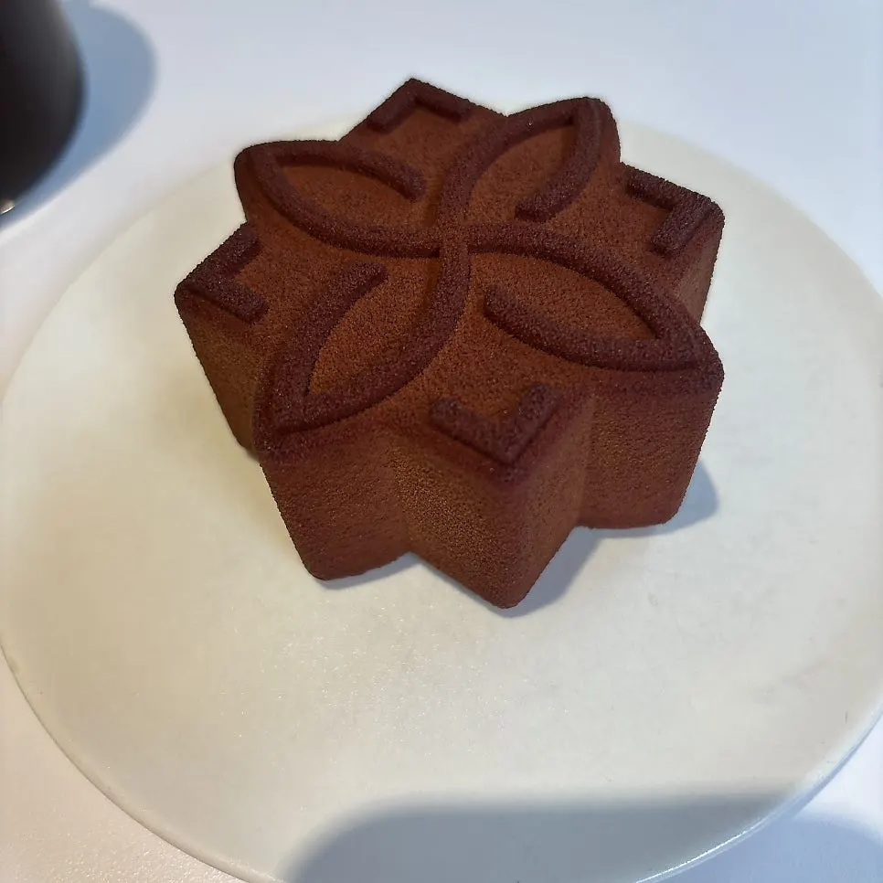 Cross-section of a pistachio madeleine cut in half
