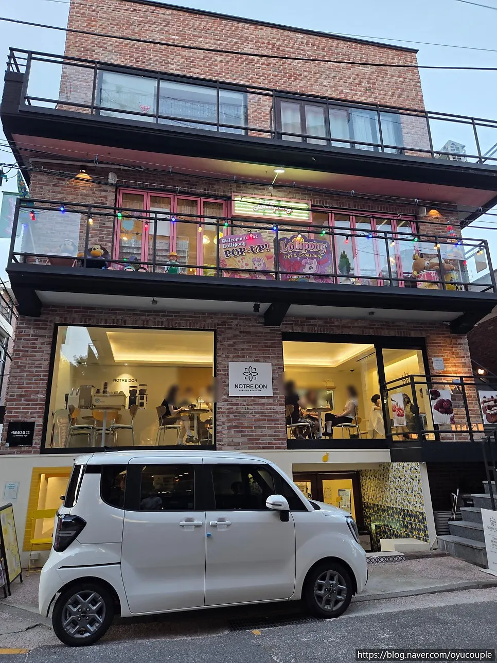 Notldun's ground-floor entrance and sign
