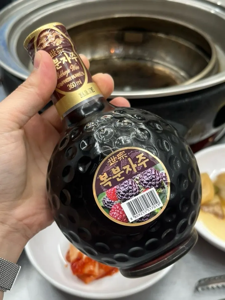 Complimentary bokbunja wine from the opening event