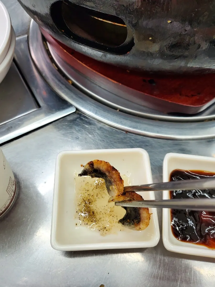 Thick piece of eel dipped in salt