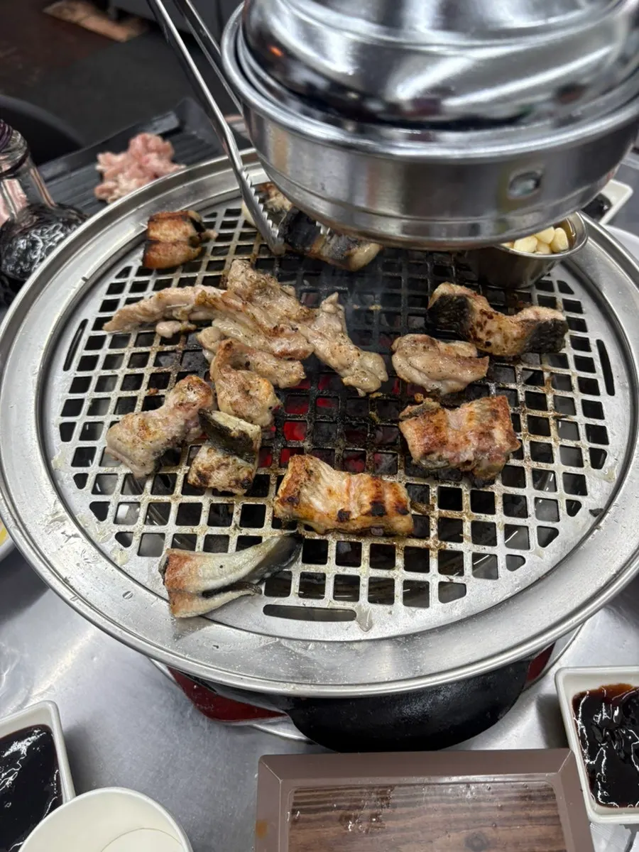 Freshwater eel being grilled skin-side down first