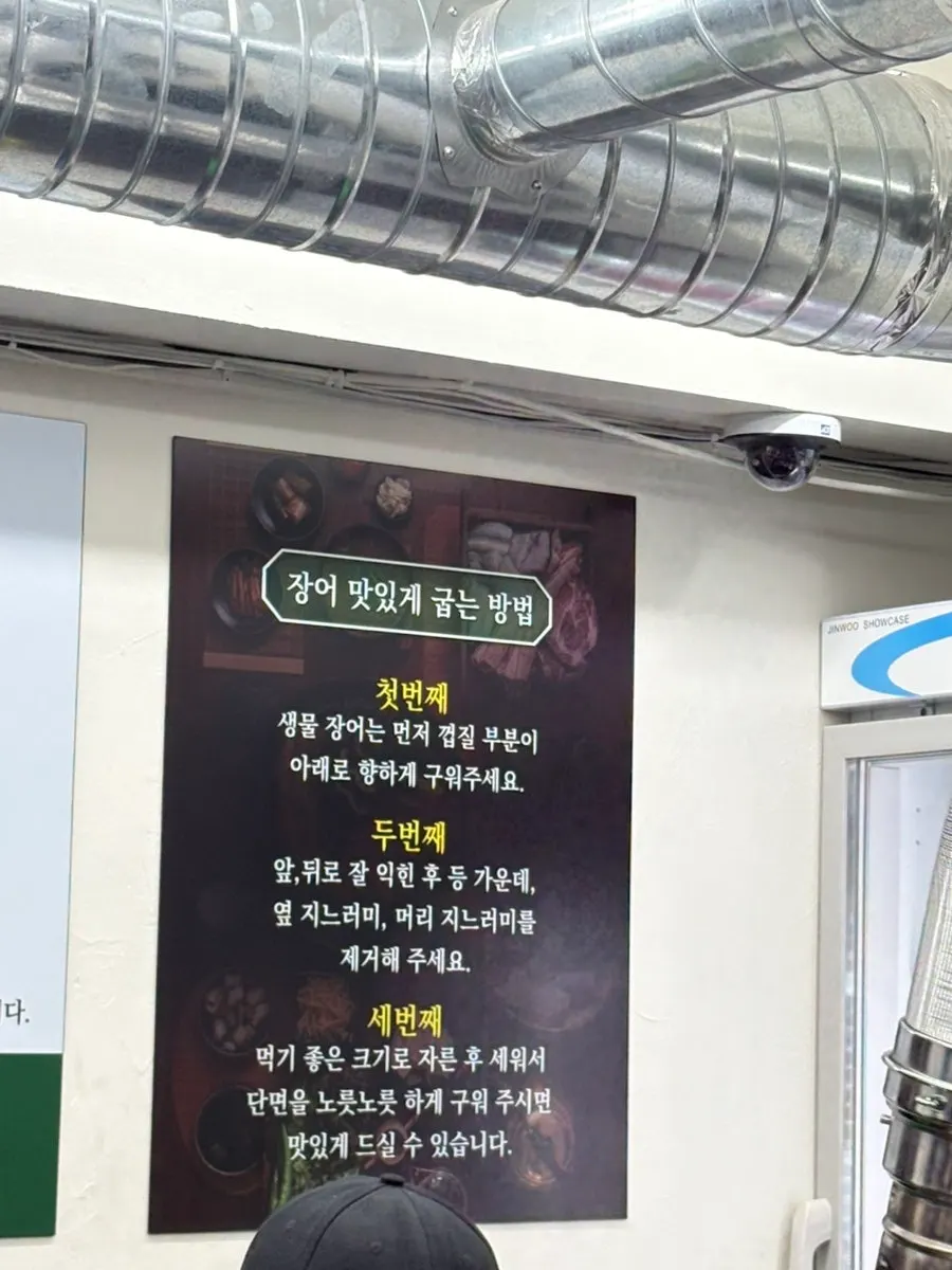 Corner of the restaurant with takeout signage
