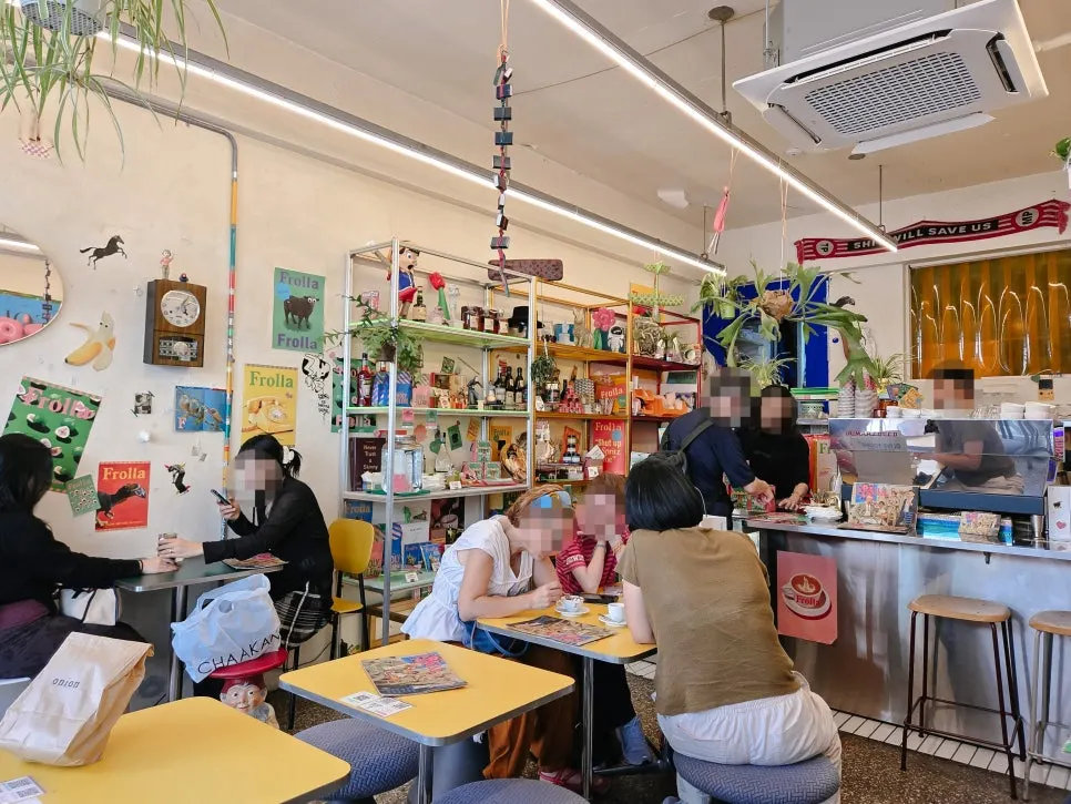 Frolla's interior seen through the floor-to-ceiling windows