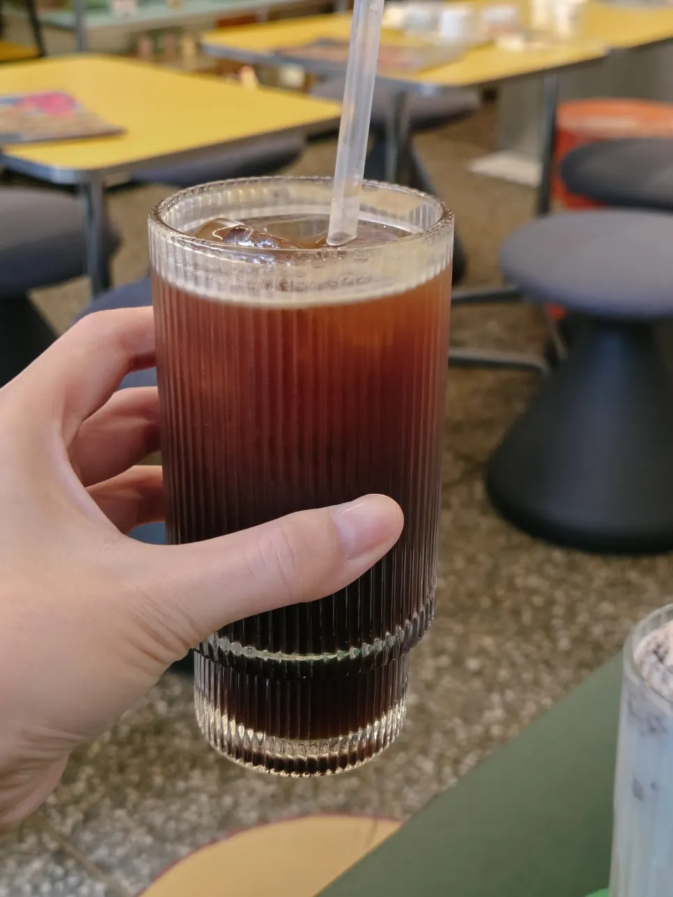 A cup of Americano brewed with low-acidity beans