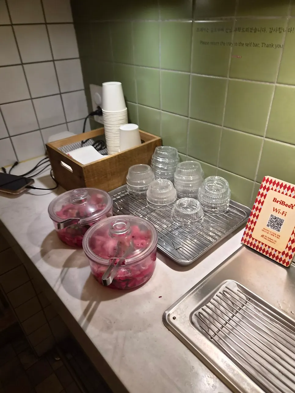 Self-serve bar with water and pickles