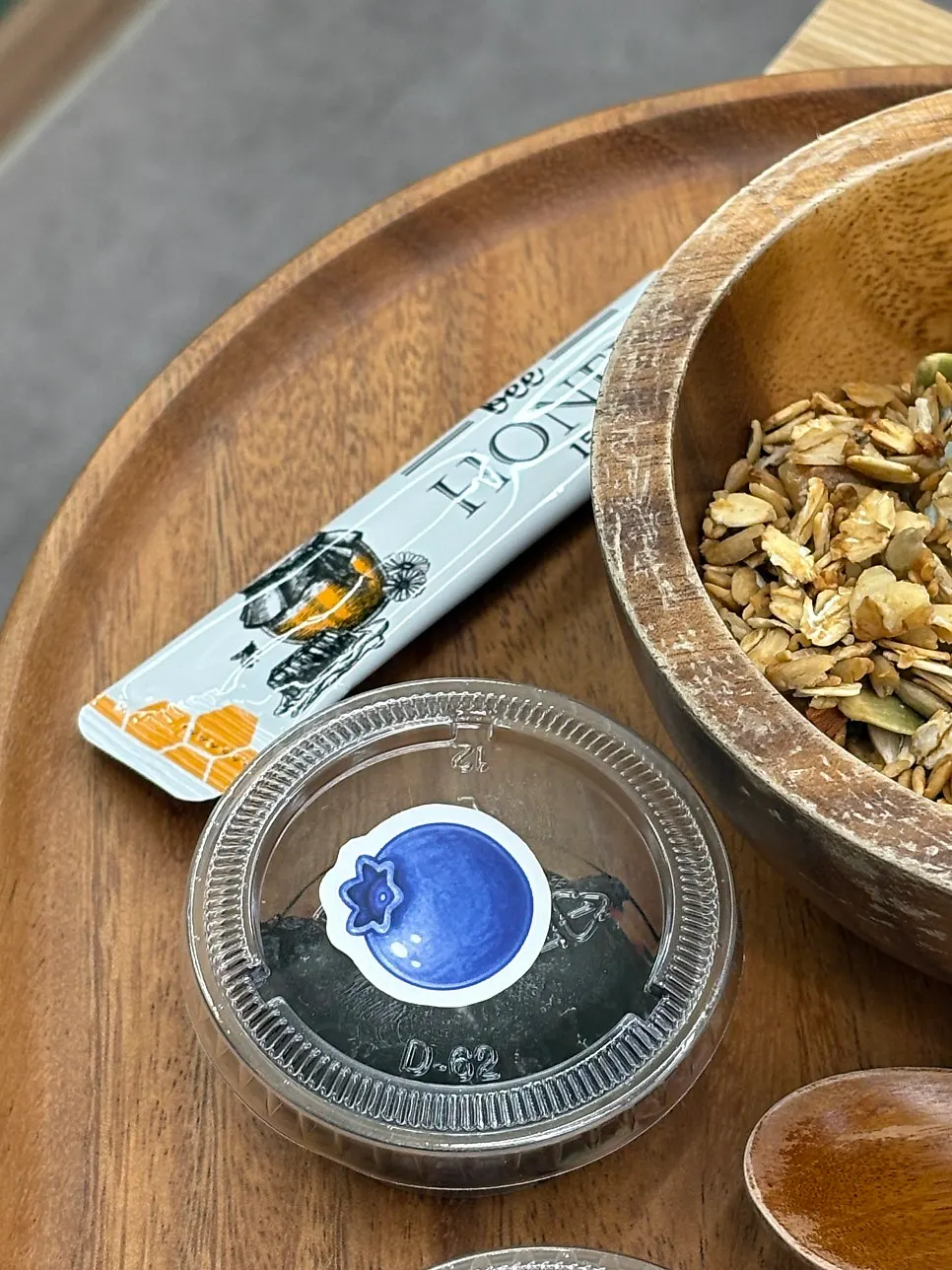 A spoonful of Beh with blueberry and granola