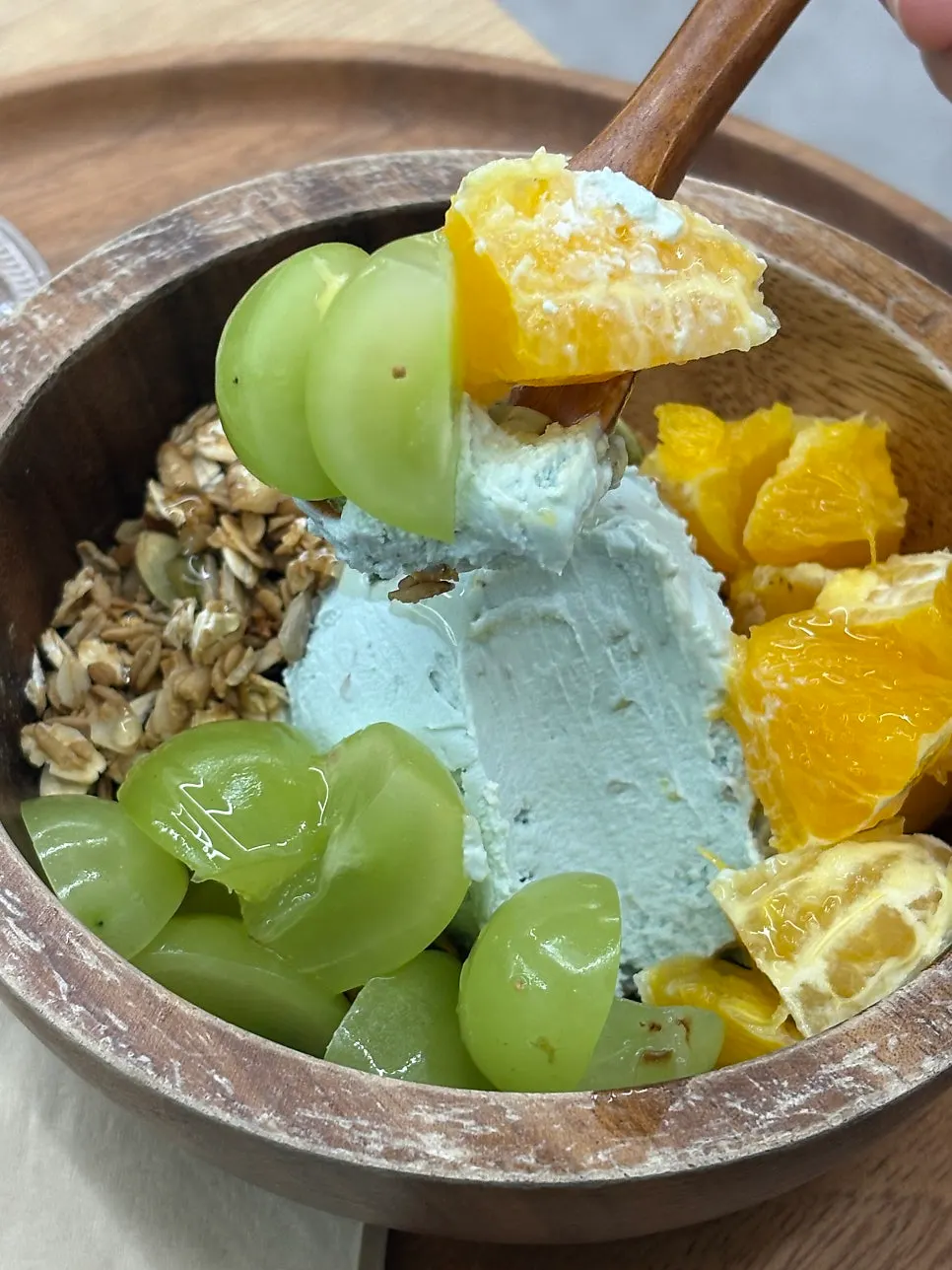 Claire topped with orange and green grape