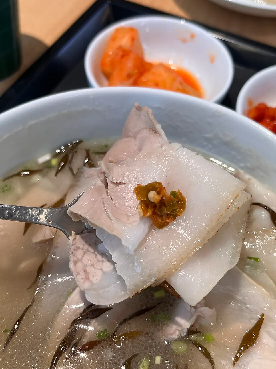 Giant mandu cut open, showing juicy filling