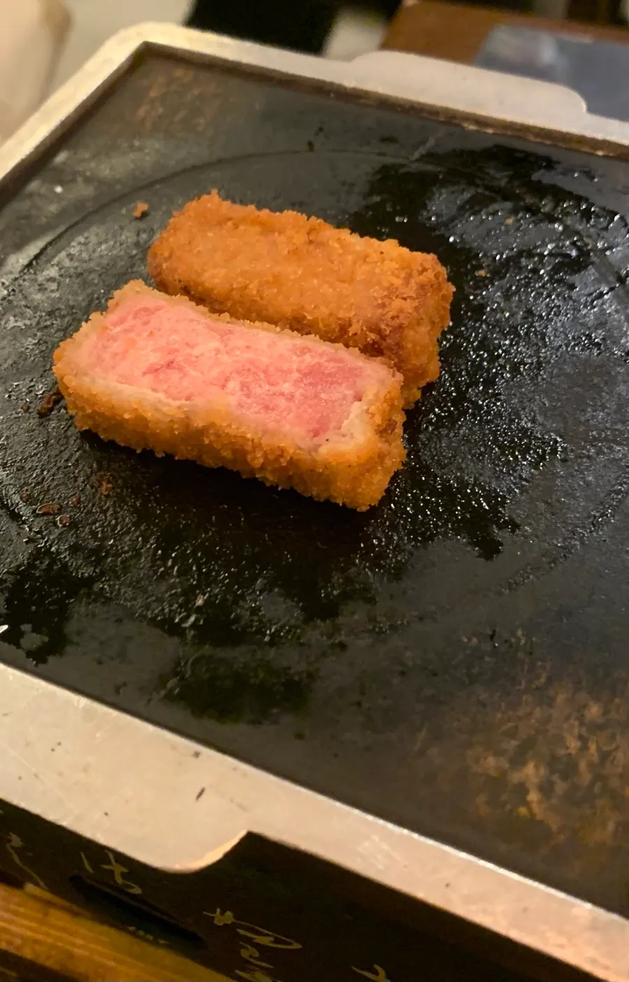 Tenderloin gyukatsu cooking on the heated brazier