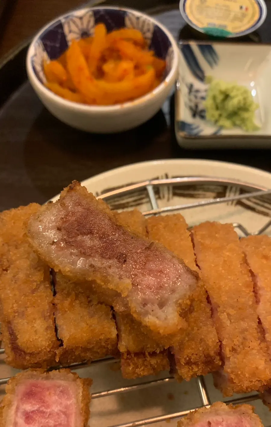 A piece of gyukatsu grilled to a golden-brown outside