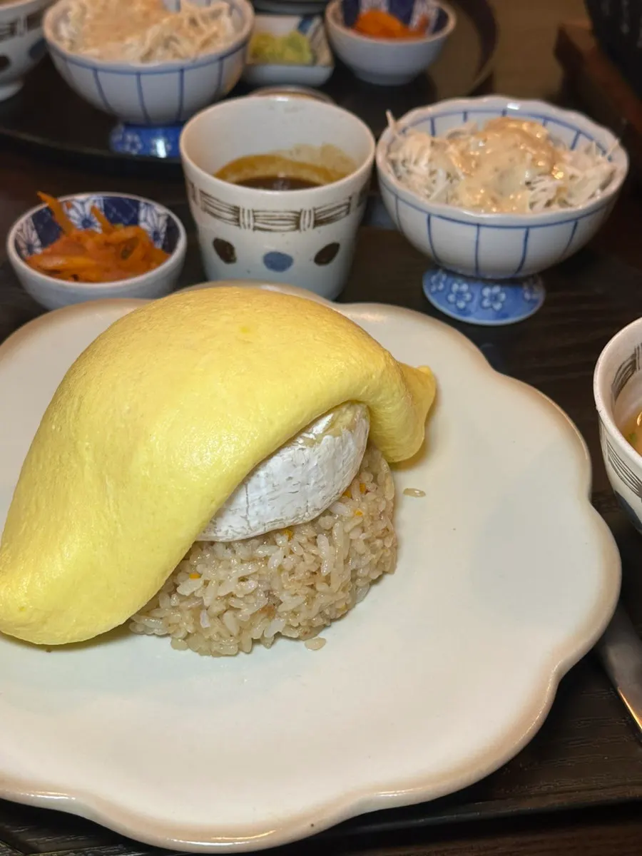 Brie cheese omurice served with sauce