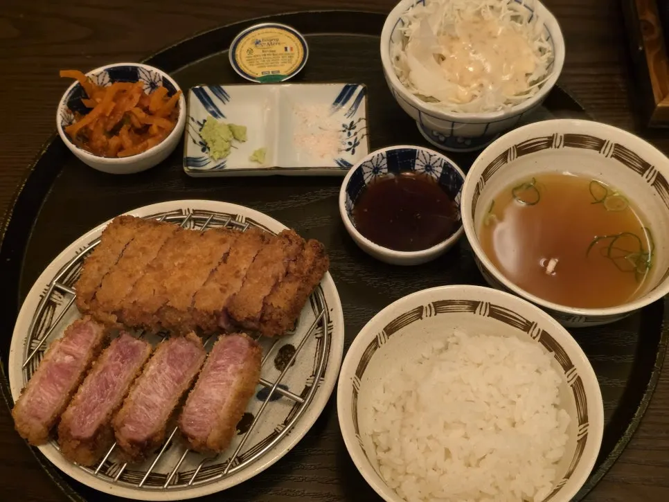 Tenderloin gyukatsu served with rice, miso soup, and cabbage salad