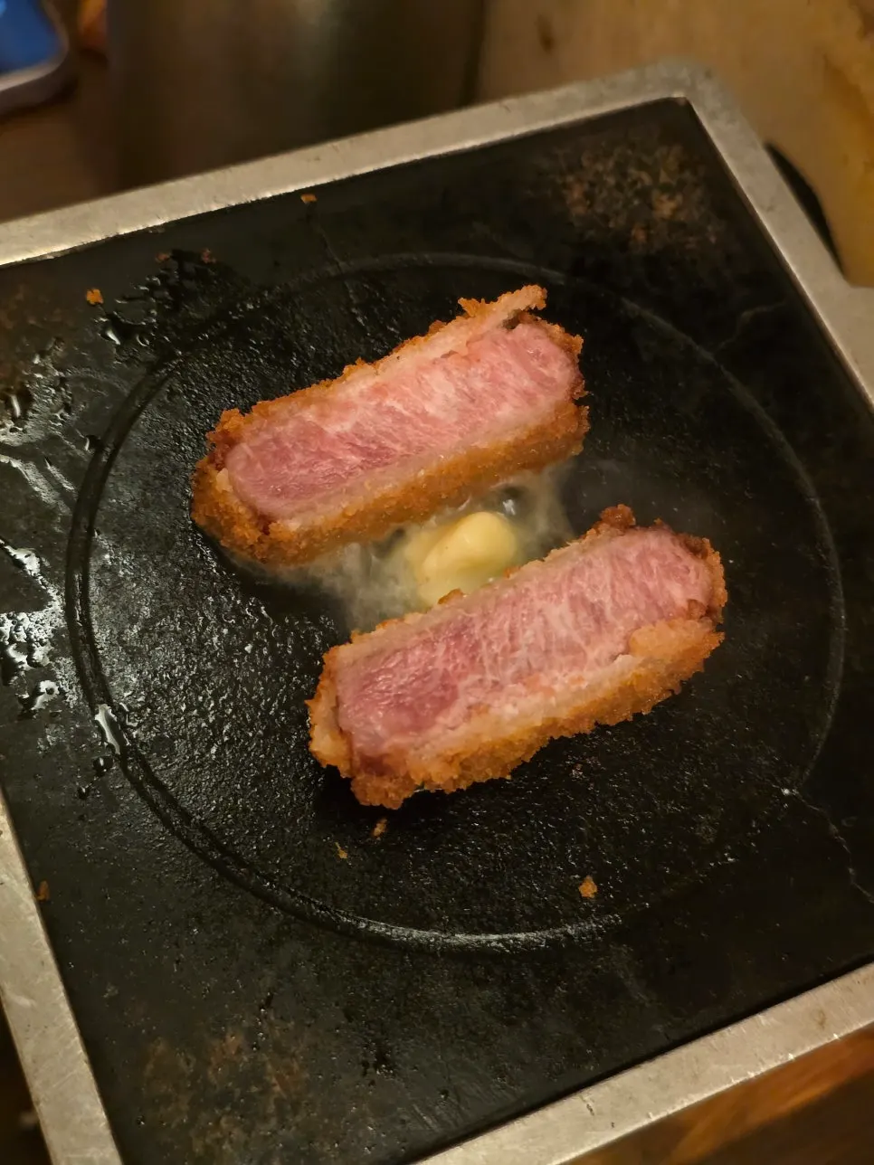 Gyukatsu being grilled on the burner topped with Isigny butter