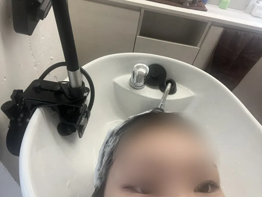 Getting a thorough shampoo after the cut