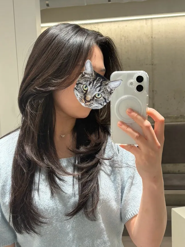 Finished layered cut with bangs swept to the side