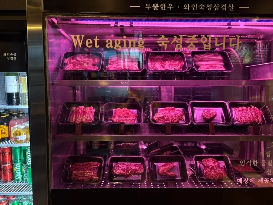 Aged beef and liquor display inside Marblejeong