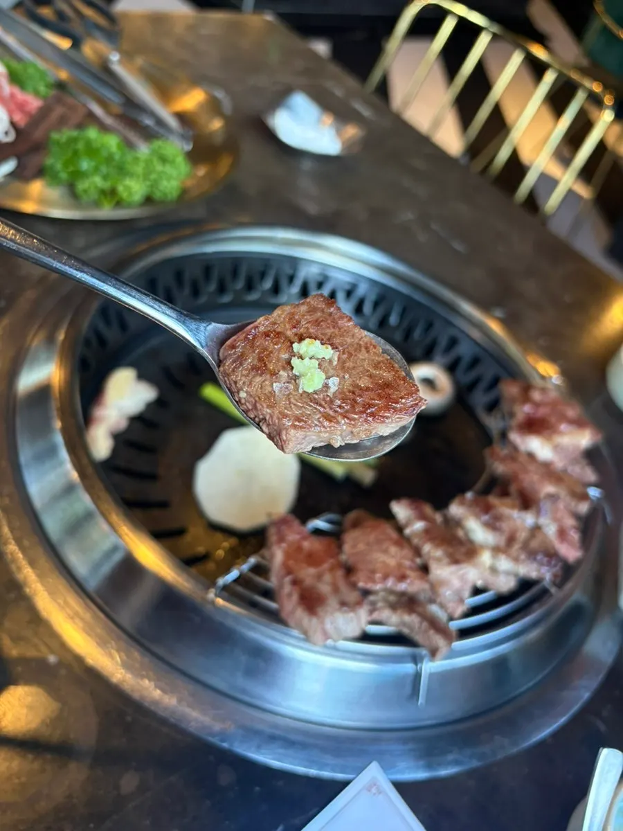 Korean beef cooking on the grill