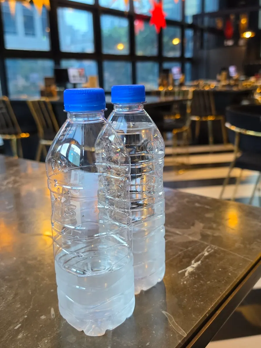 Individually wrapped utensils and a 500ml bottle of water