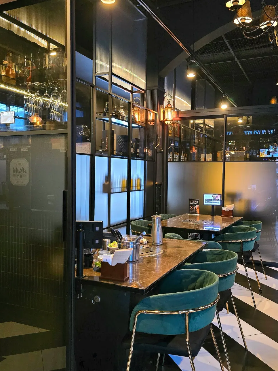 Bar-style space at Marblejeong with wine and glasses on display