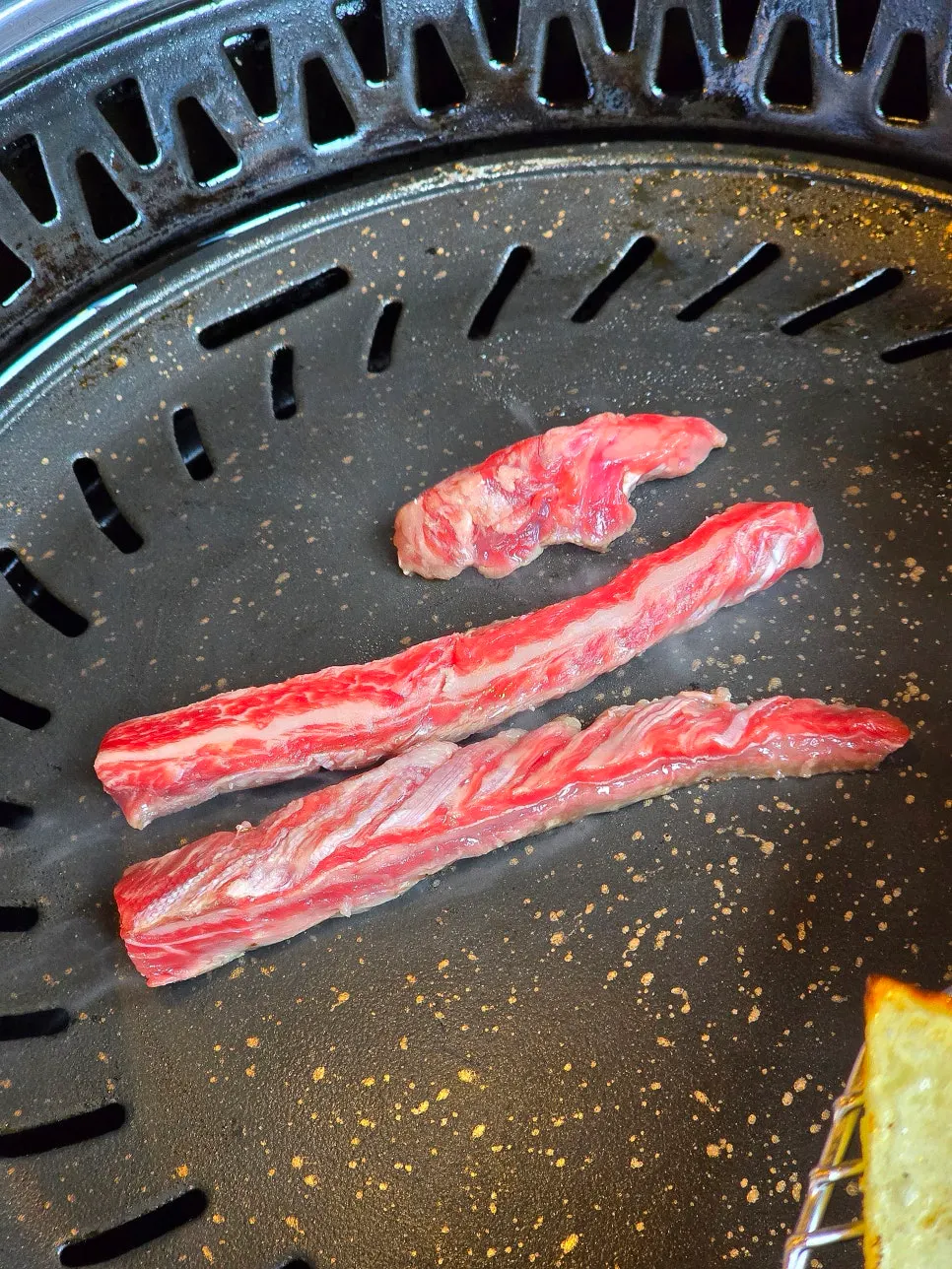 Picking up a grilled piece of premium sirloin