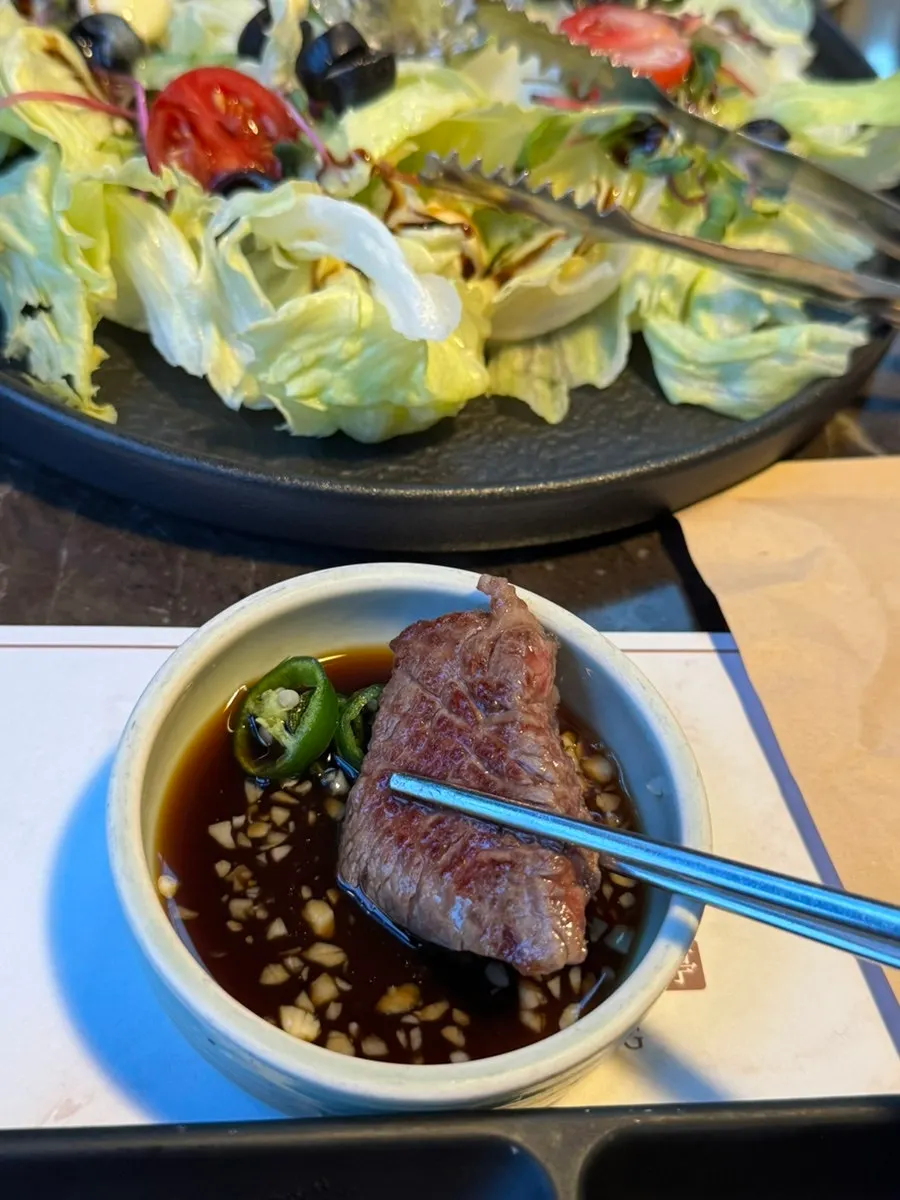 Grilled sirloin placed on a small plate
