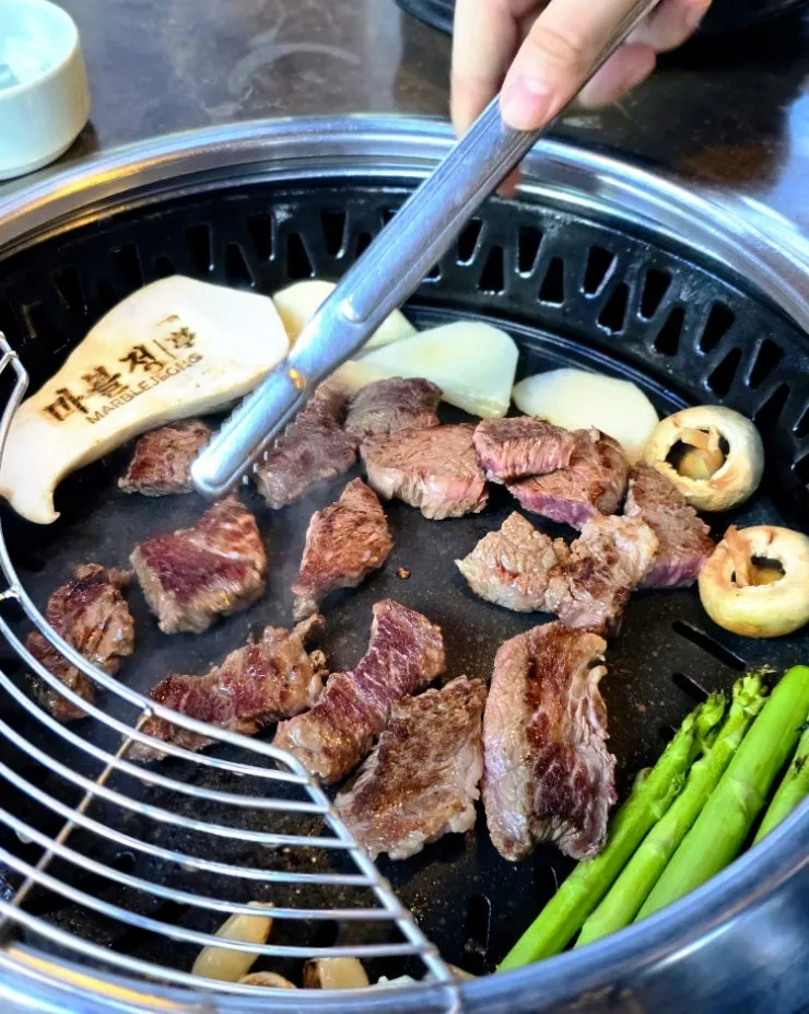 Mixed Korean beef platter with sirloin, salchisal, and brisket