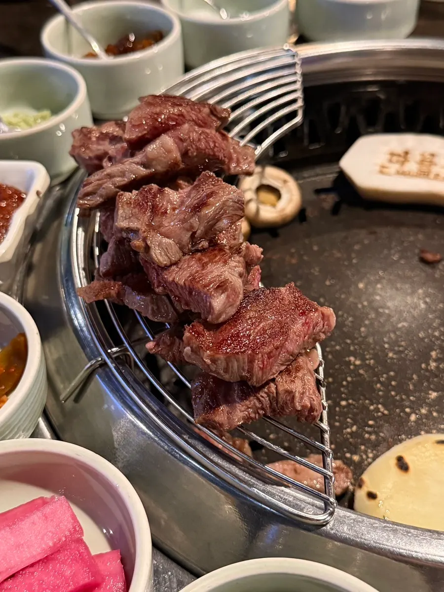 Grade 1++ Korean beef sirloin grilling on the grill