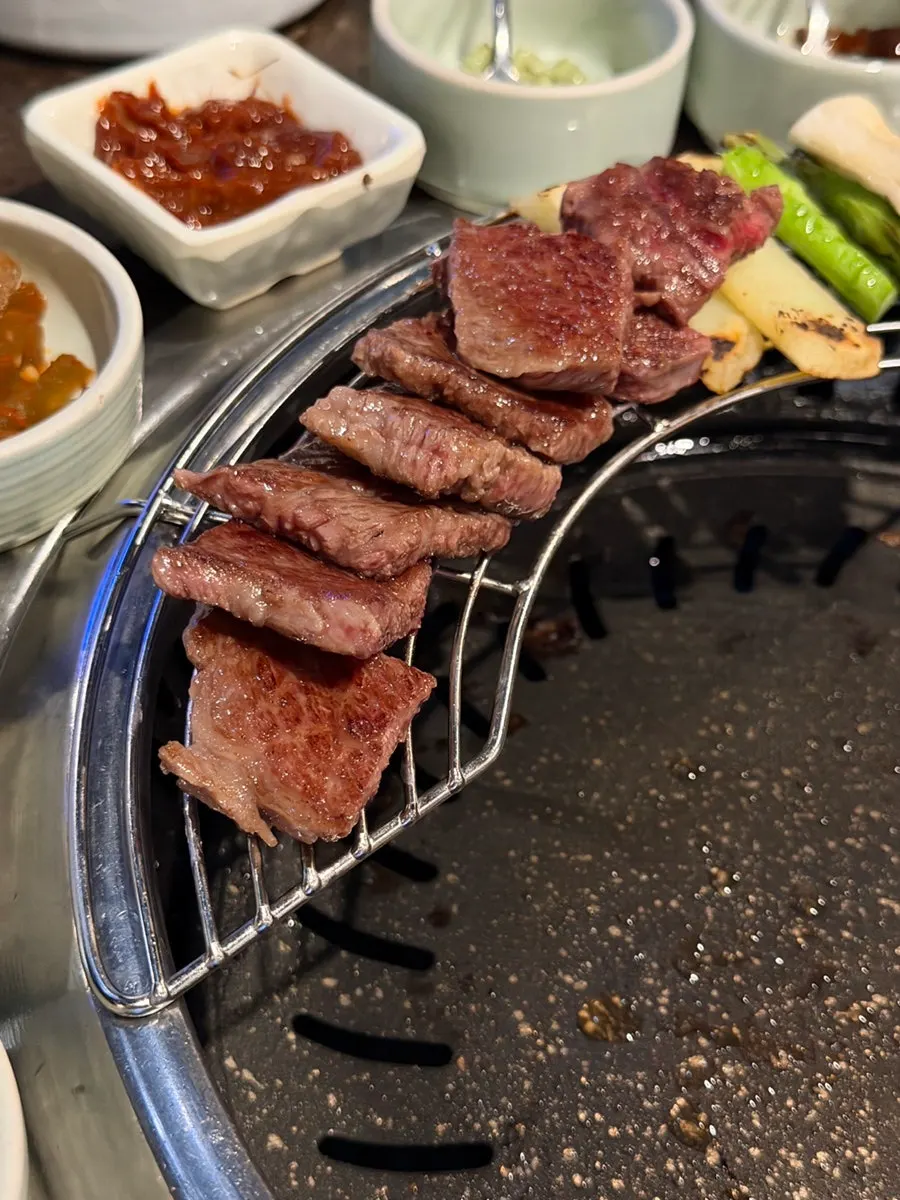 Asparagus and potatoes served alongside the grilled meat