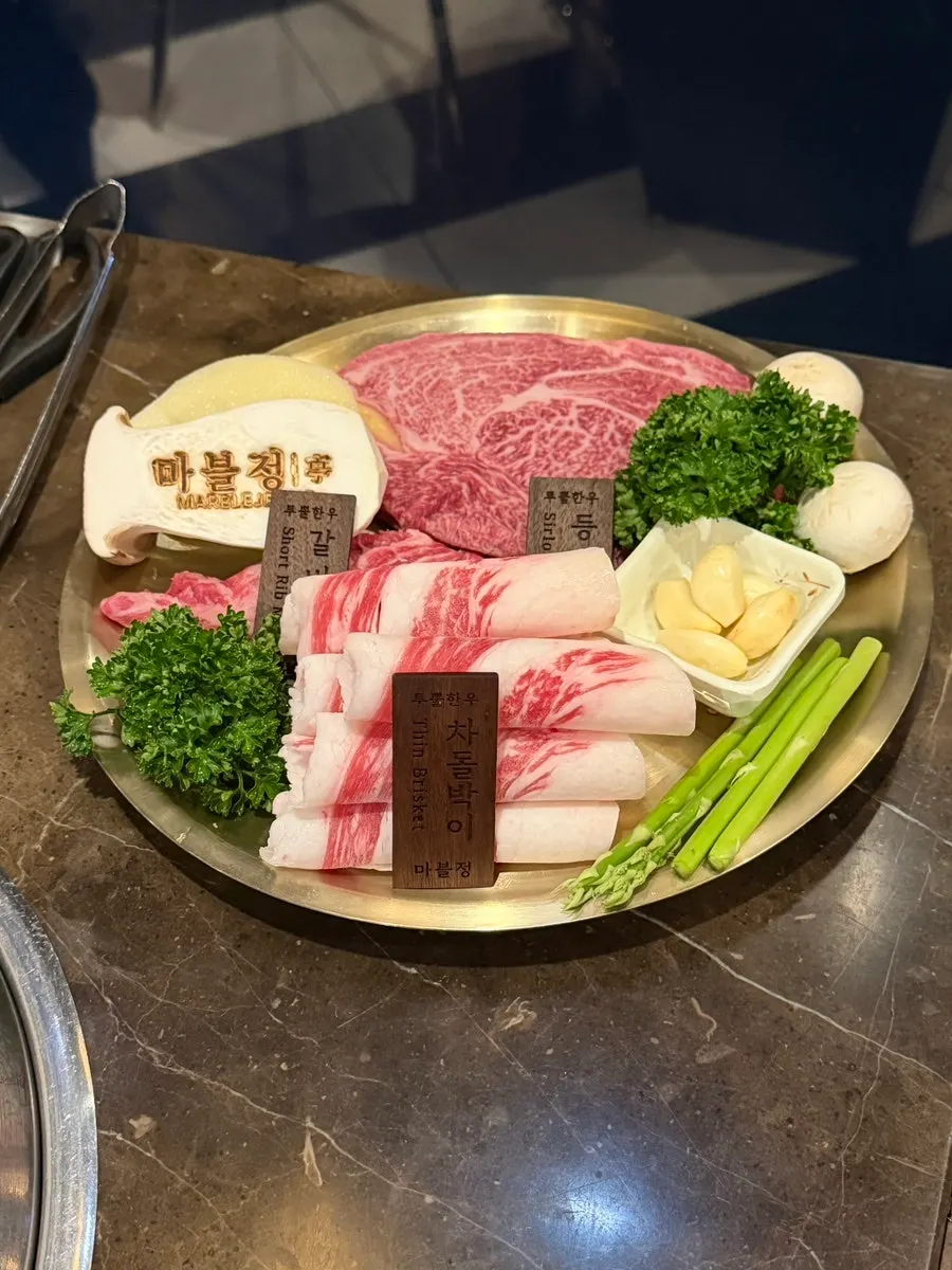 Neatly arranged side dishes and dipping sauces