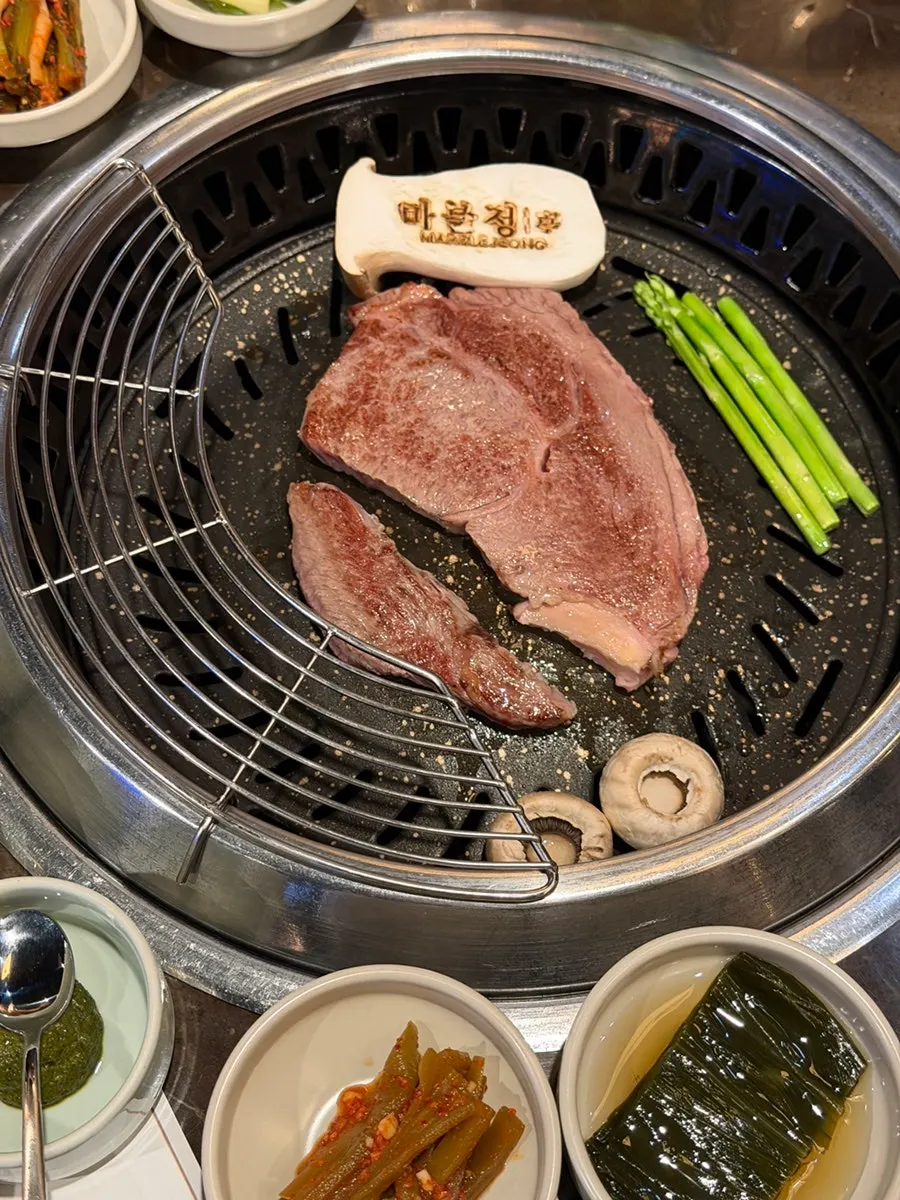 Korean beef sirloin grilling on the tabletop grill