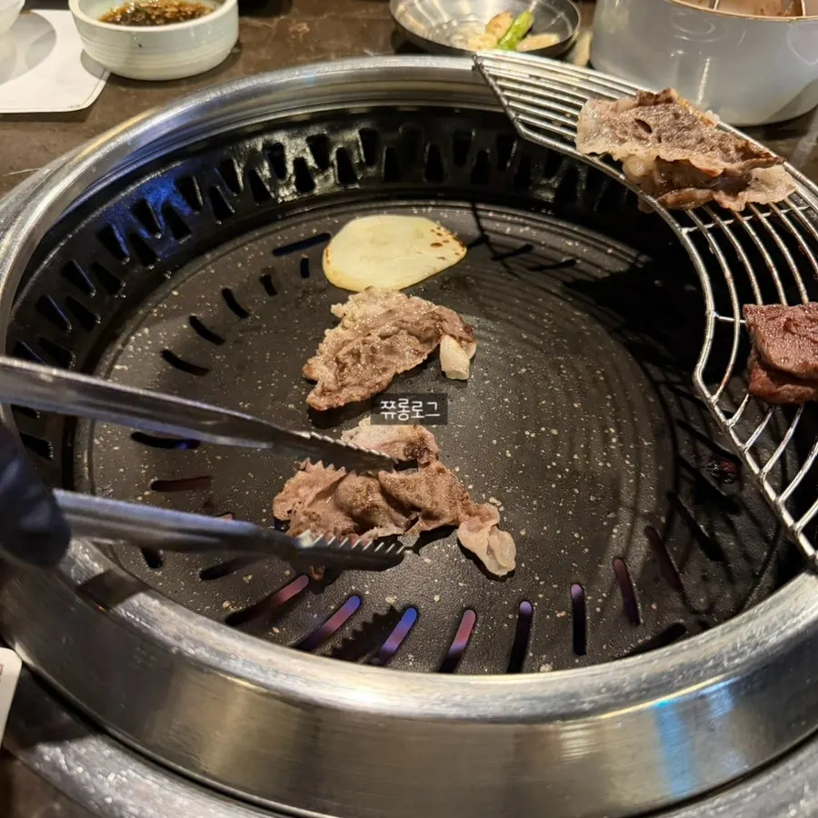 A piece of skirt steak dipped in sauce