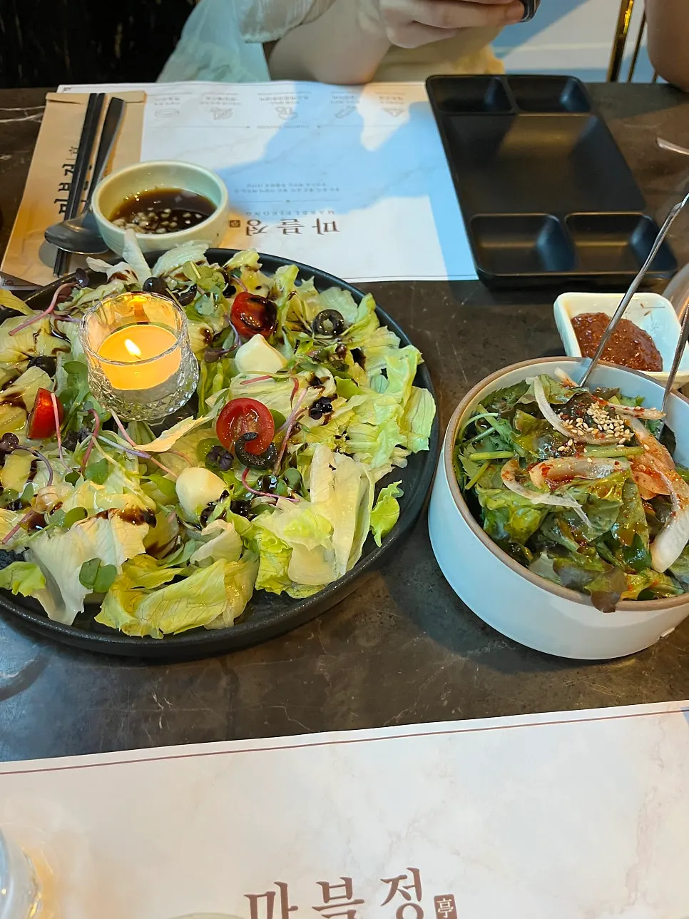 Salad and myeongi namul side dishes at Marblejeong