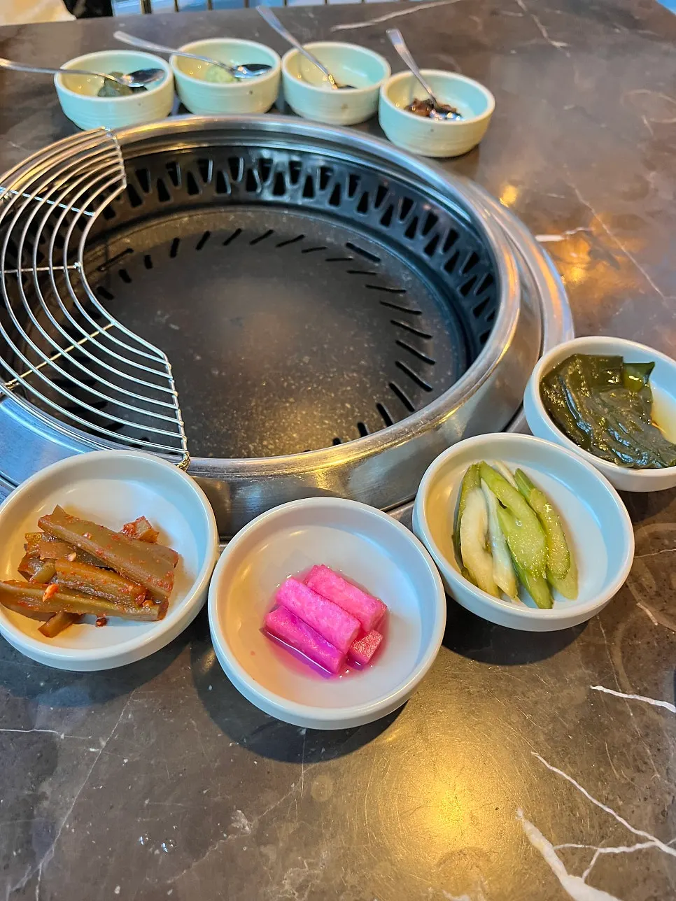 Plate of pickled vegetable side dishes at Marblejeong