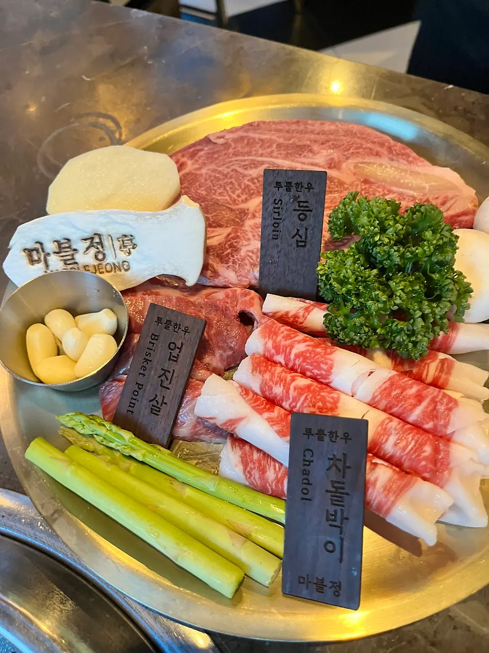 Plate of raw 1++ Korean beef mixed grill at Marblejeong
