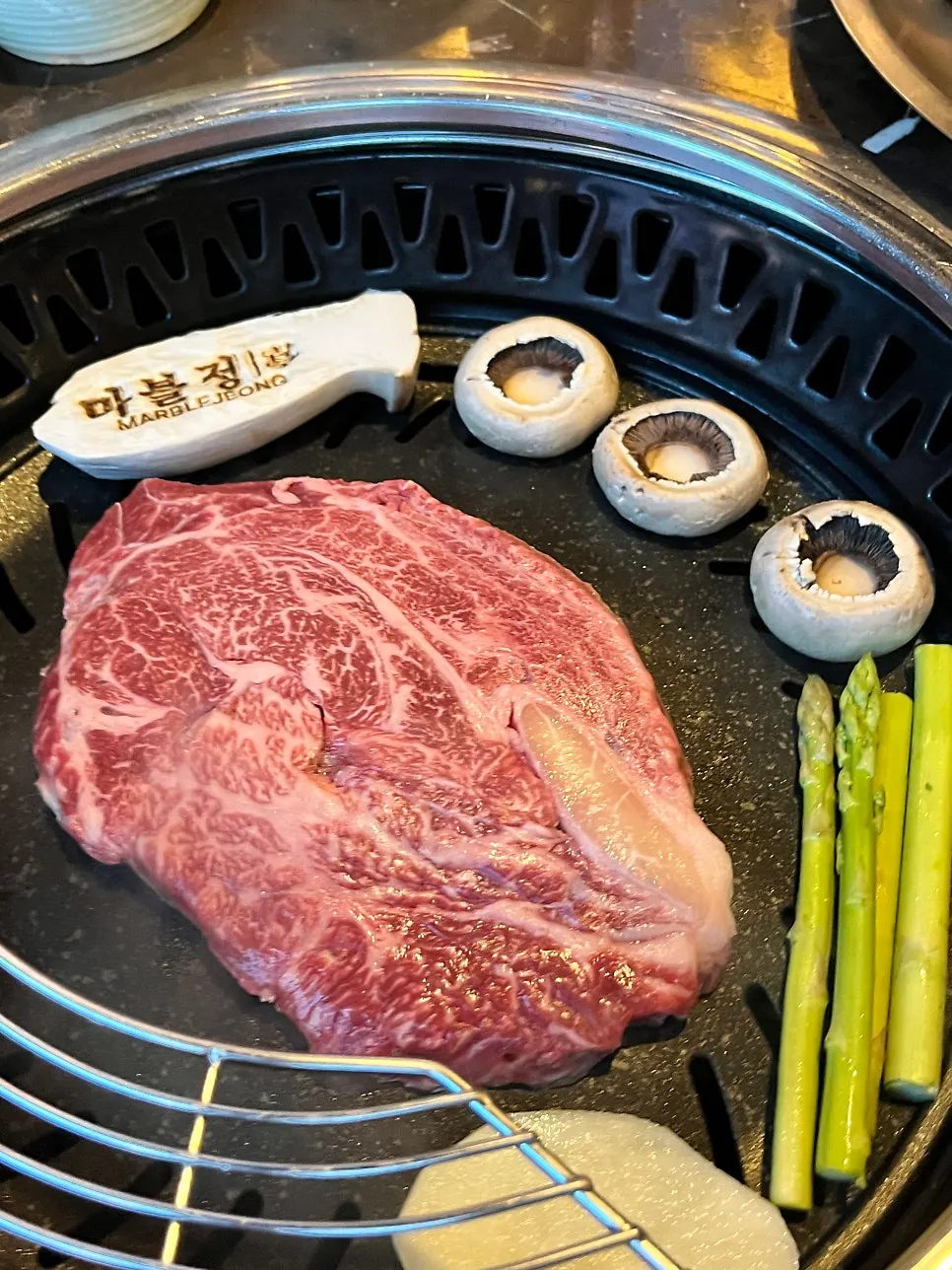 Marblejeong's 1++ Korean beef on the grill
