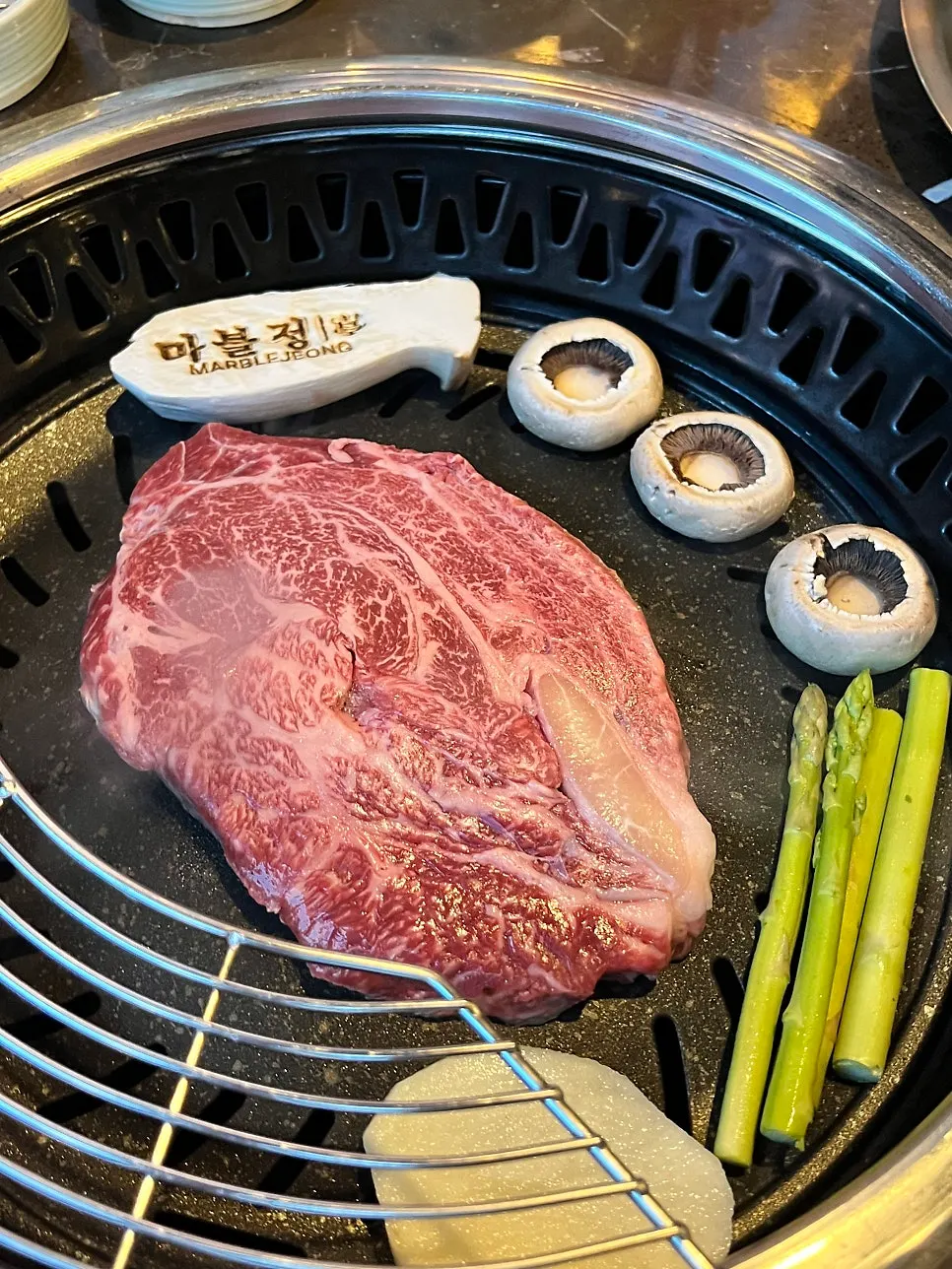 1++ Korean beef being grilled