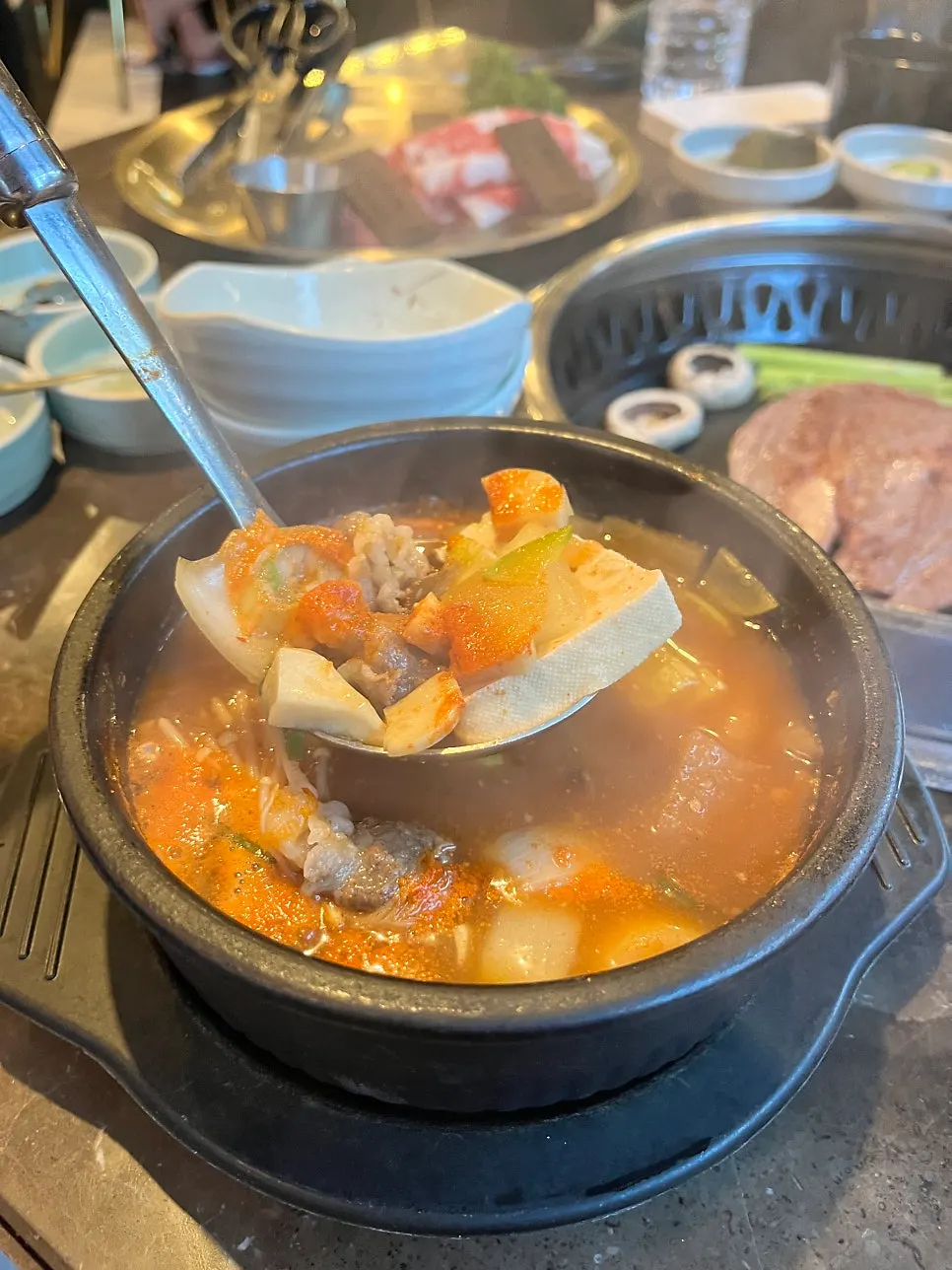Broth with visible brisket in the doenjang stew